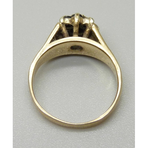 1078 - A 9ct gold cluster ring set with a central illusion set diamond weighing approximately 0.02ct, surro... 