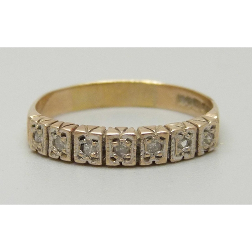 1084 - A 9ct gold ring set with seven diamonds, approximately 0.14ct, Birmingham, 1979, marked LDP, 2.6g, S