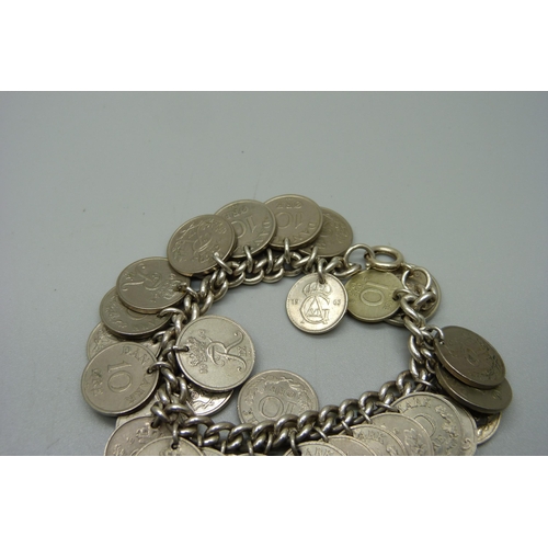 1108 - A silver bracelet with Denmark 10 Ore coin charms