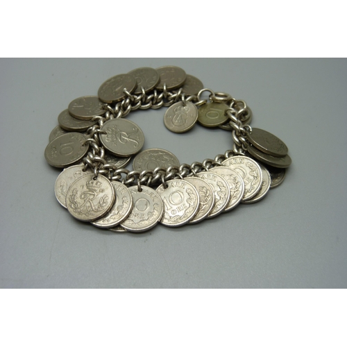 1108 - A silver bracelet with Denmark 10 Ore coin charms