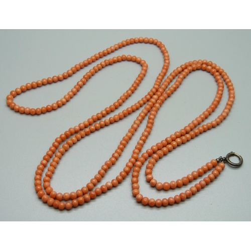 1124 - A coral long guard chain with bolt fastener, 152cm, 67g