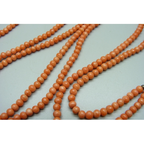 1124 - A coral long guard chain with bolt fastener, 152cm, 67g