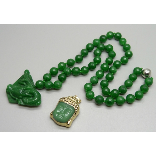 1125 - A jade style bead necklace with dragon pendant and a Buddha pendant