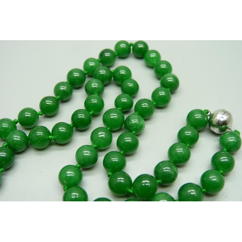 1125 - A jade style bead necklace with dragon pendant and a Buddha pendant