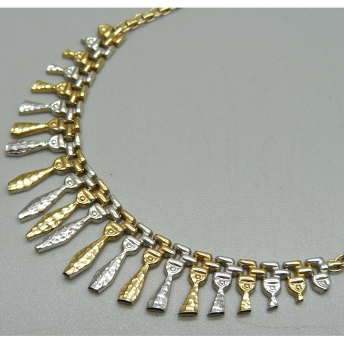 1128 - A 9ct gold necklet, 7.3g