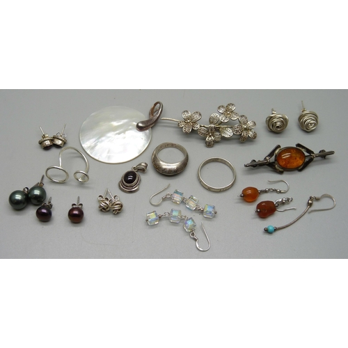 1131 - A collection of silver jewellery including two brooches, pendant, rings, etc.