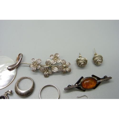 1131 - A collection of silver jewellery including two brooches, pendant, rings, etc.