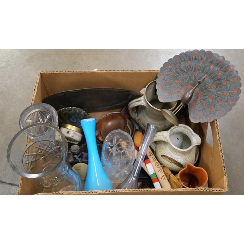 1170 - A box of assorted items, Indian brass peacock, charger, studio pottery, travel clocks, treen, a box ... 