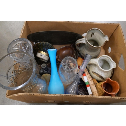 1170 - A box of assorted items, Indian brass peacock, charger, studio pottery, travel clocks, treen, a box ... 