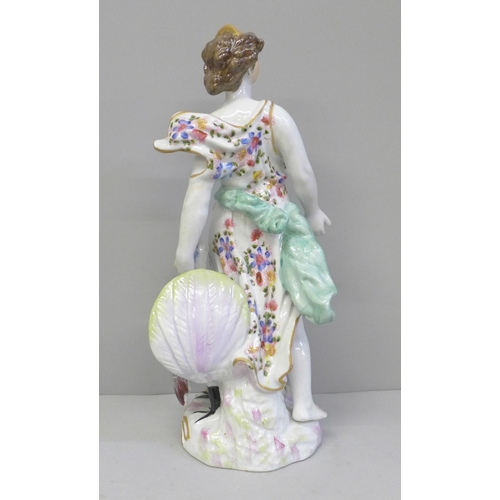 612 - A 19th Century porcelain figure of Juno and the Peacock, 26.5cm