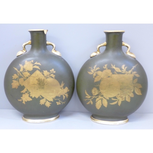 614 - A pair of Charles Barlow Staffordshire moon flask vases with oriental decoration, one a/f (rim with ... 
