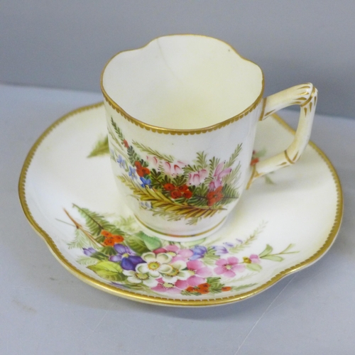 629 - A 19th Century Royal Worcester cup and saucer decorated with sprays of flowers, cup a/f, hairline, a... 