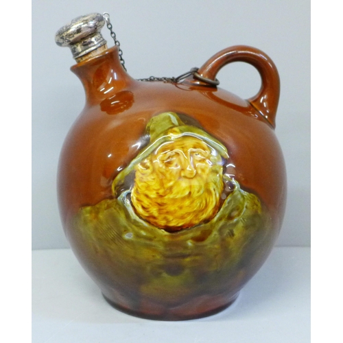 631 - A Royal Doulton treacle glaze flask with silver topped stopper, decorated with Jolly Sailor and Mari... 