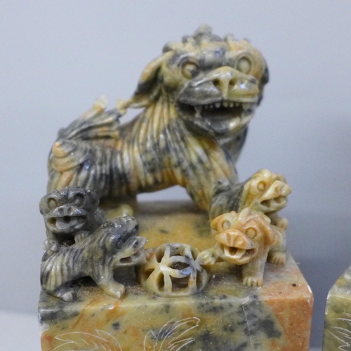 637 - A pair of Chinese carved soapstone bookends, 16cm