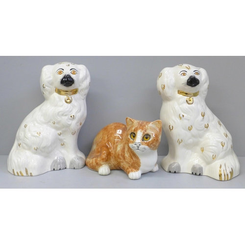653 - A pair of Beswick Staffordshire spaniels and a Mike Hinton model of a cat, very small glaze chip to ... 