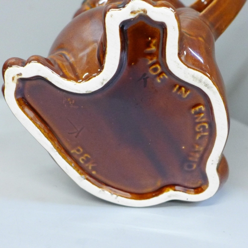 656 - A treacle glaze snuff taker teapot with old repairs and modern P & K brown glaze rabbit teapot