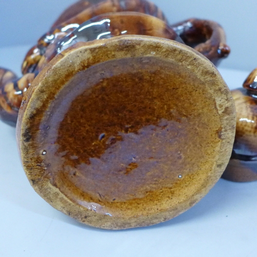 656 - A treacle glaze snuff taker teapot with old repairs and modern P & K brown glaze rabbit teapot