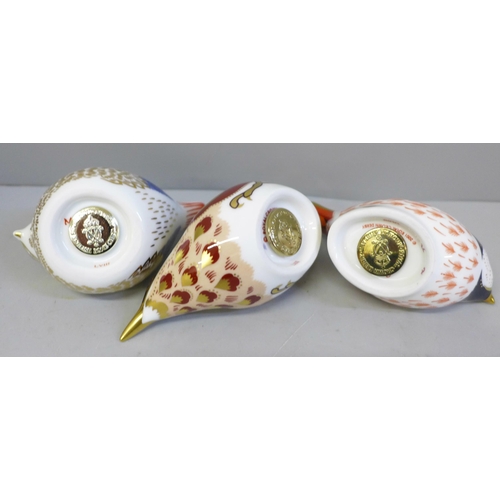 666 - Three Royal Crown Derby paperweights, Goldcrest, Nuthatch and Coal Tit, two with gold stoppers, boxe... 