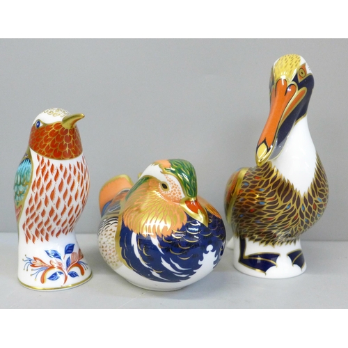 668 - Three Royal Crown Derby paperweights, Brown Pelican, Mandarin Duck and Hummingbird, boxed