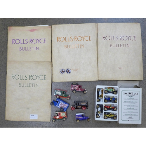 674 - A collection of Rolls-Royce Bulletins and two Rolls-Royce badges and model cars