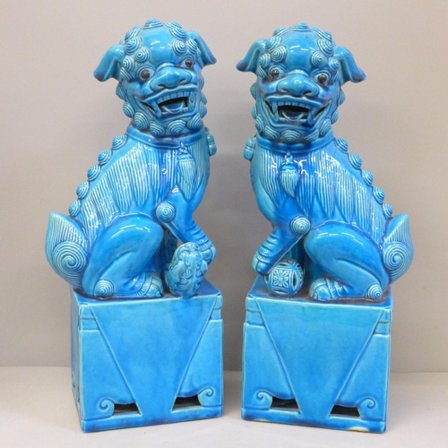 679 - A pair of pottery Chinese dogs of foo, cobalt blue, 37cm