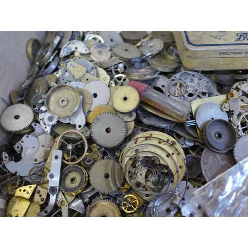 683 - A collection of watch repair materials/horological parts including springs, balances