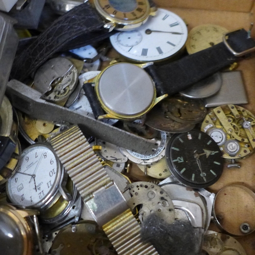 683 - A collection of watch repair materials/horological parts including springs, balances