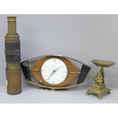 685 - A Metamec Art Deco style clock, an Indian brass candle stand and a leather bound telescope