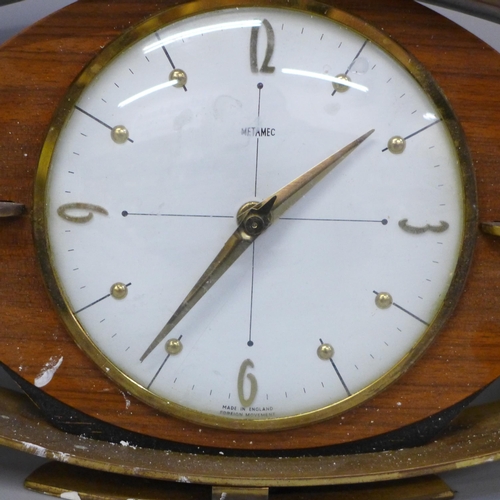 685 - A Metamec Art Deco style clock, an Indian brass candle stand and a leather bound telescope