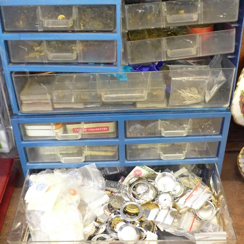 694 - Two plastic cabinets containing watch parts