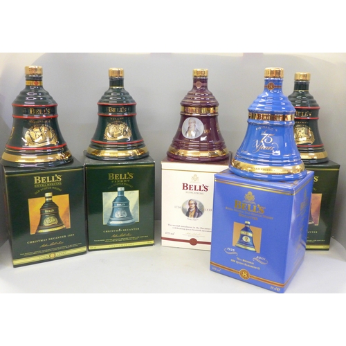 723 - Five Wade Bell's Whisky decanters comprising three Christmas decanters and two bottles of Extra Spec... 