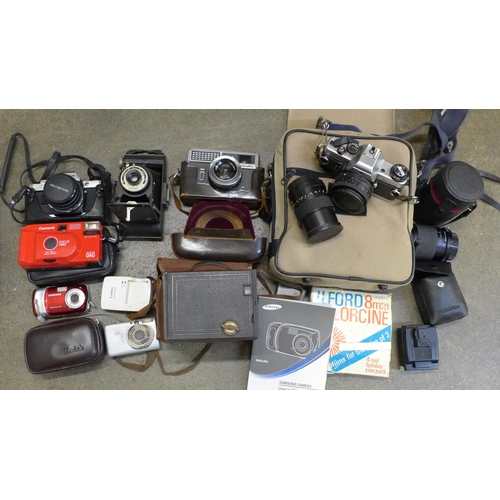 752 - Cameras; Praktica BCX with lenses and bag, Olympus OM10 with two lenses and flash unit, a Minolta ca... 