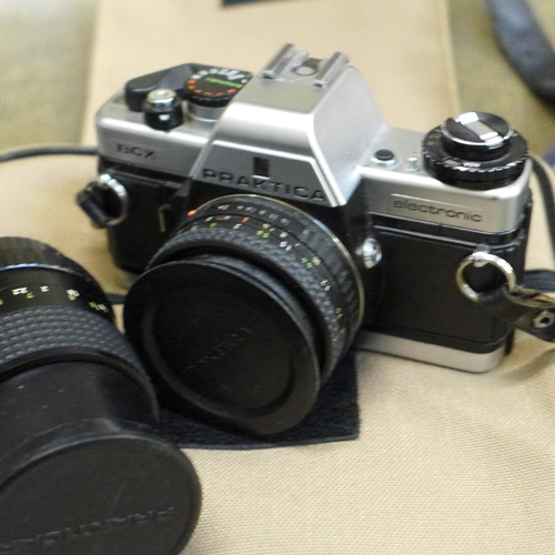 752 - Cameras; Praktica BCX with lenses and bag, Olympus OM10 with two lenses and flash unit, a Minolta ca... 