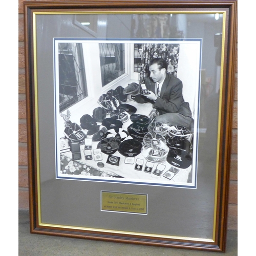 756 - Football; a scarce silver gelatin 400 x 370 photograph of Sir Stanley Matthews at home with his meda... 