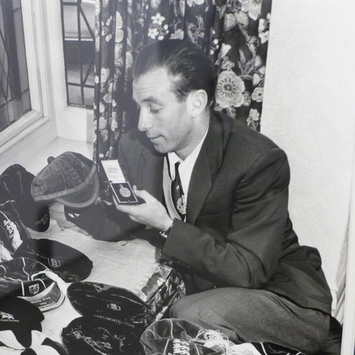 756 - Football; a scarce silver gelatin 400 x 370 photograph of Sir Stanley Matthews at home with his meda... 