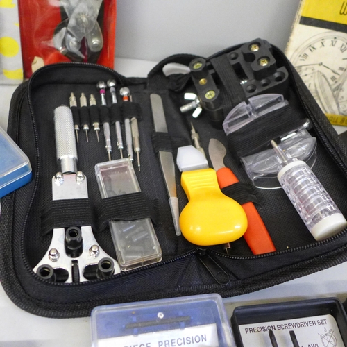 782 - A collection of watch repair equipment including tools, a microscope, diamond tester, etc.