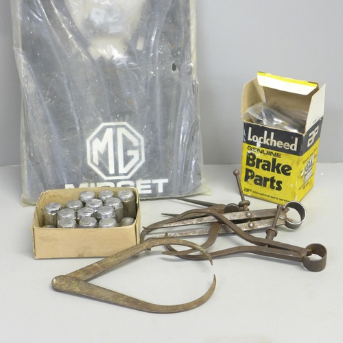 789 - Sixteen MG wheel locking nuts, a set of MG Midget mud flaps, a set of Lockheed LDB-15 brake pads and... 