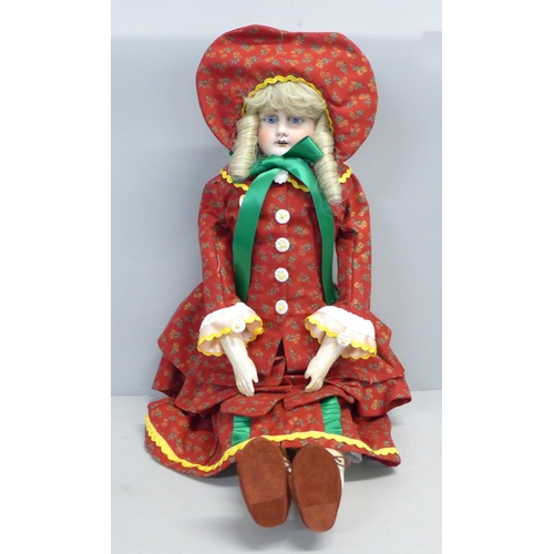 809 - An early German bisque head doll, with kid leather body, believed to be late 19th Century (been in o... 