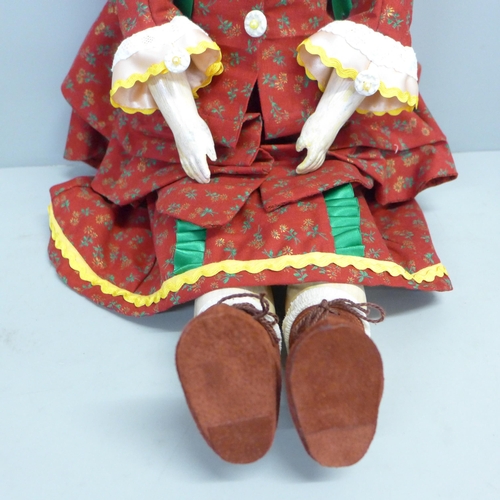 809 - An early German bisque head doll, with kid leather body, believed to be late 19th Century (been in o... 