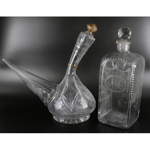 827 - An oversized spirit decanter engraved with flowers and foliage, and a sangria carafe