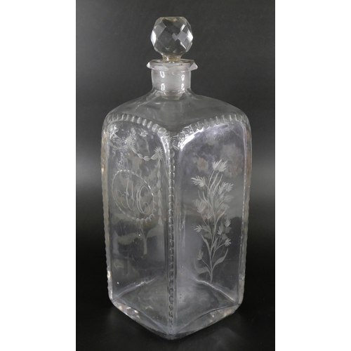 827 - An oversized spirit decanter engraved with flowers and foliage, and a sangria carafe