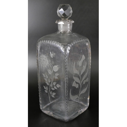 827 - An oversized spirit decanter engraved with flowers and foliage, and a sangria carafe