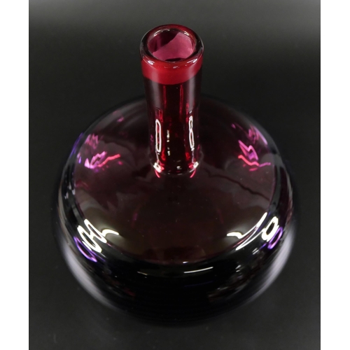 830 - Bob Crooks, a spiral glass decanter in amethyst and ruby, engraved signature to the base, 33cm