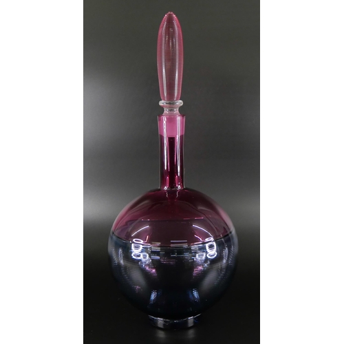 831 - Bob Crooks, a spiral glass decanter in pale blue and cranberry, engraved signature to the base, 36cm