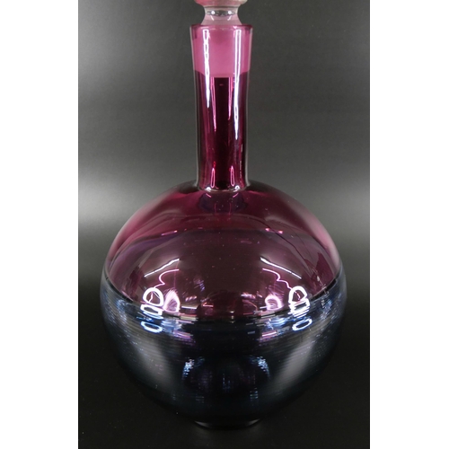 831 - Bob Crooks, a spiral glass decanter in pale blue and cranberry, engraved signature to the base, 36cm