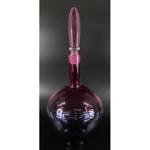 831 - Bob Crooks, a spiral glass decanter in pale blue and cranberry, engraved signature to the base, 36cm