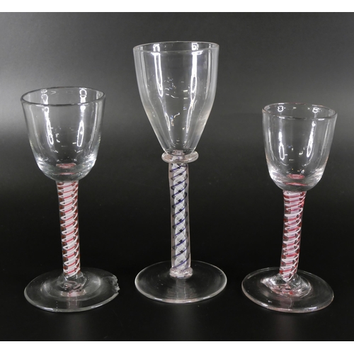 851 - An 18th Century continental colour twist glass and two 19th Century red double twist glasses