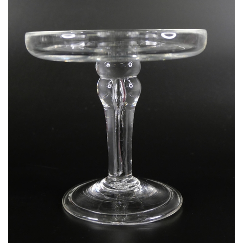 852 - A glass patch stand with balustroid stem, over a conical folded foot