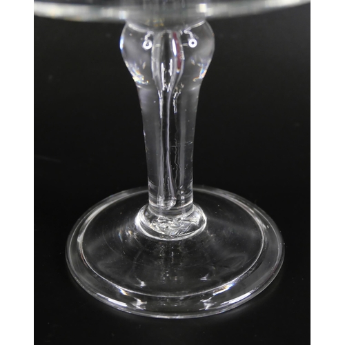 852 - A glass patch stand with balustroid stem, over a conical folded foot