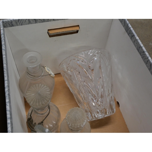 859 - Four boxes of crystal and glass including drinking glasses, decanters, jugs, some a/f